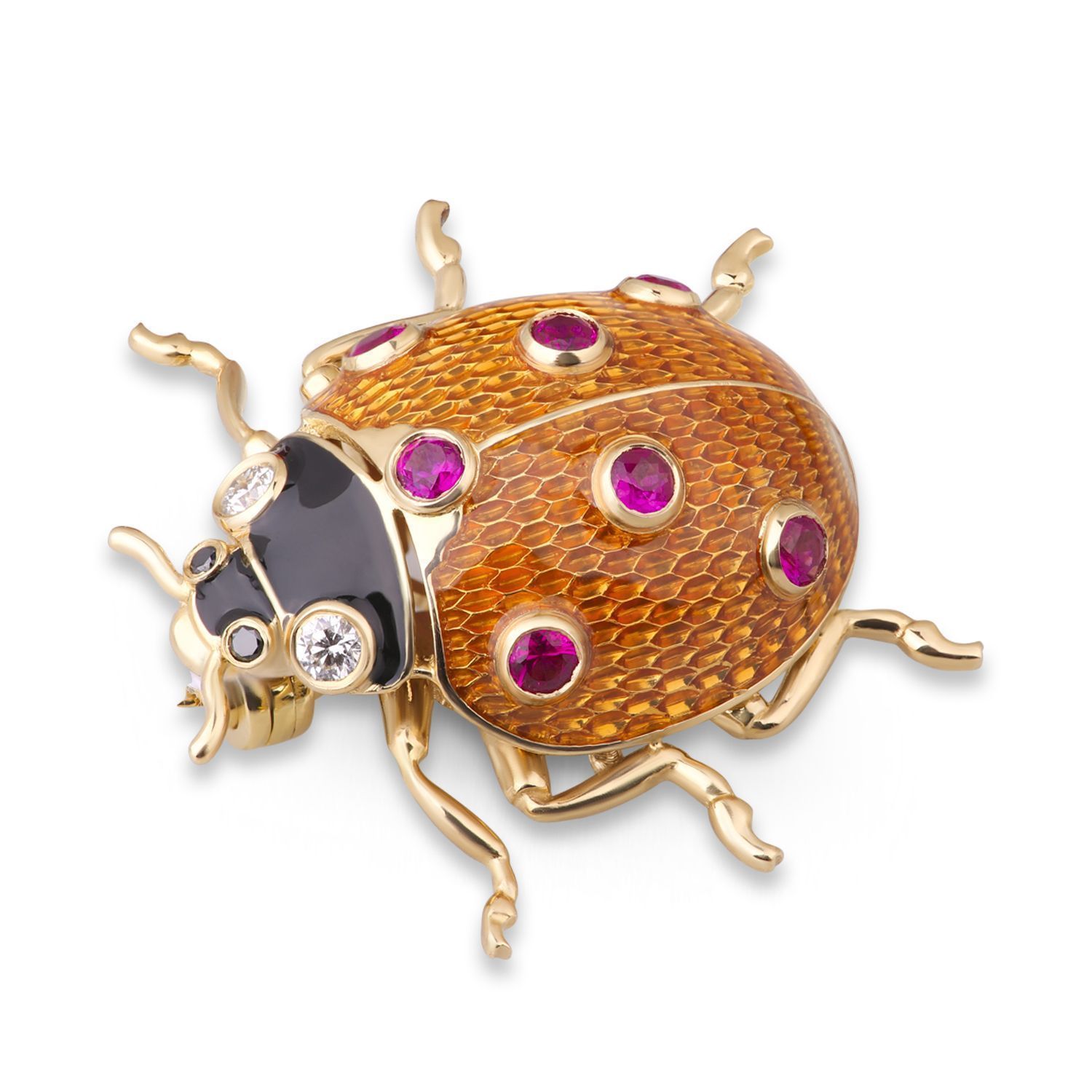 Брошь из желтого золота с рубинами и бриллиантами