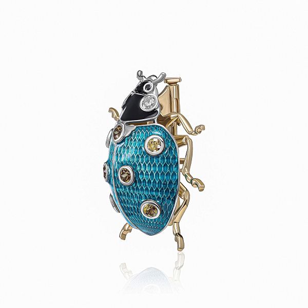 Брошь из желтого золота с бриллиантами и сапфирами