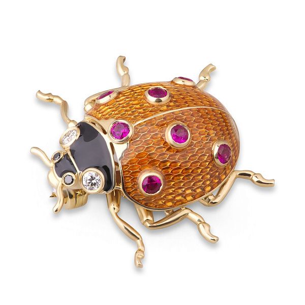 Брошь из желтого золота с рубинами и бриллиантами