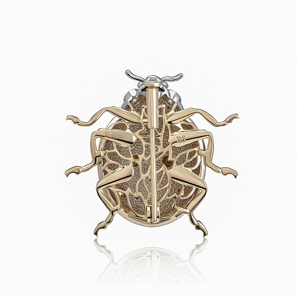 Брошь из желтого золота с бриллиантами и сапфирами