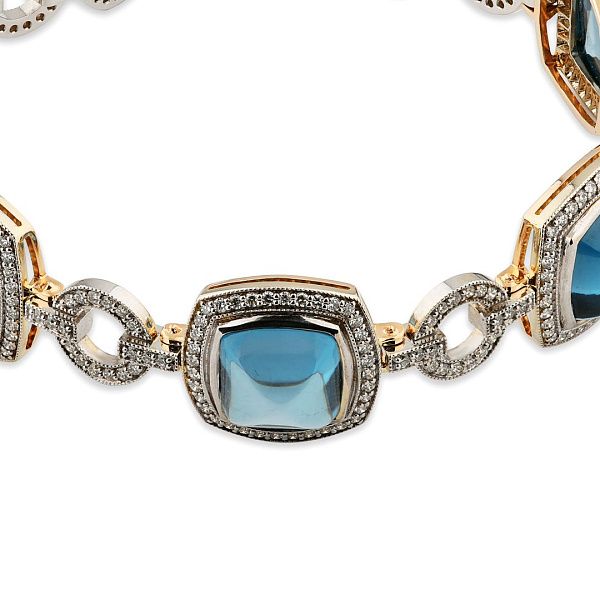 Браслет из белого золота с топазами и бриллиантами