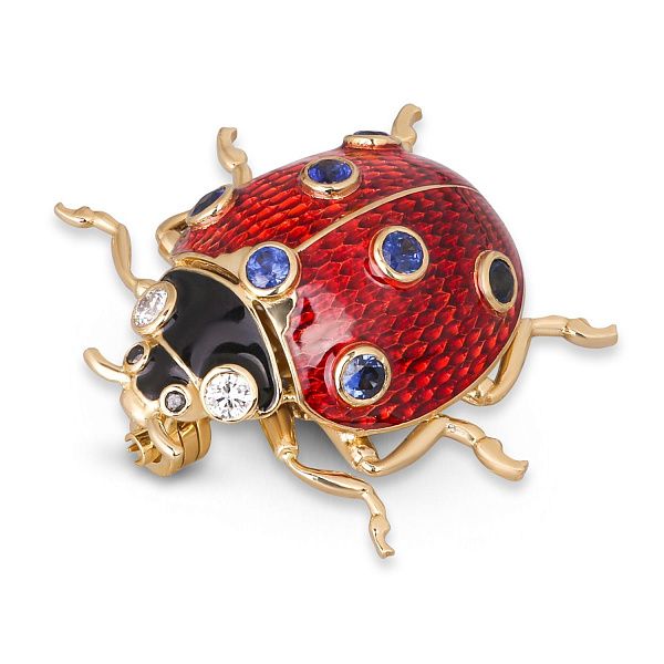 Брошь из желтого золота с сапфирами и бриллиантами